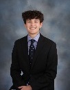 A young man who is smiling, is one of the company's owners.